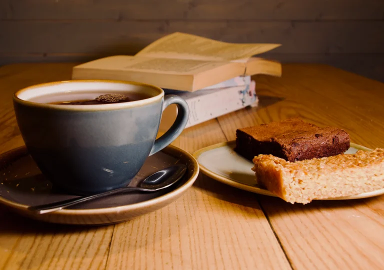 Coffee, cake and book in cafe