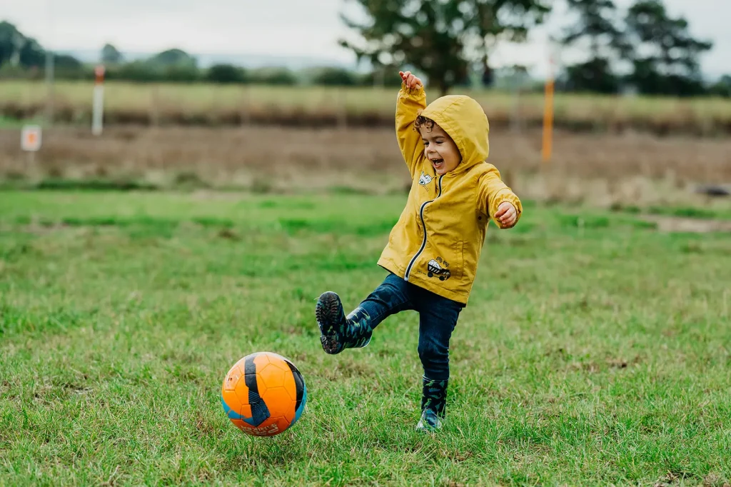 Boy playing football/footgolf